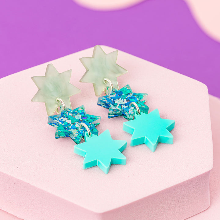 Triple Star Dangle Earrings in Light Blue Sparkle