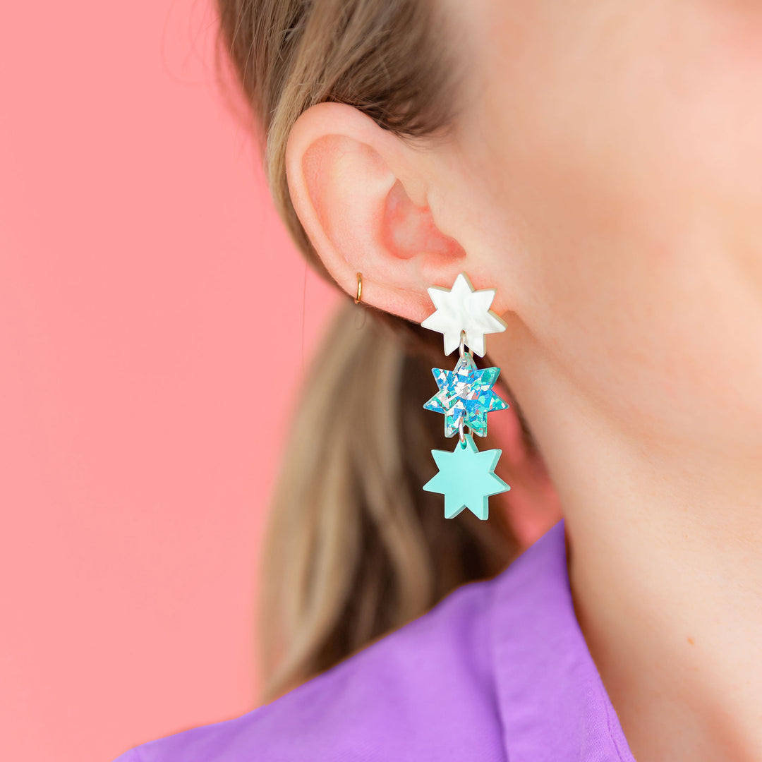 Triple Star Dangle Earrings in Light Blue Sparkle